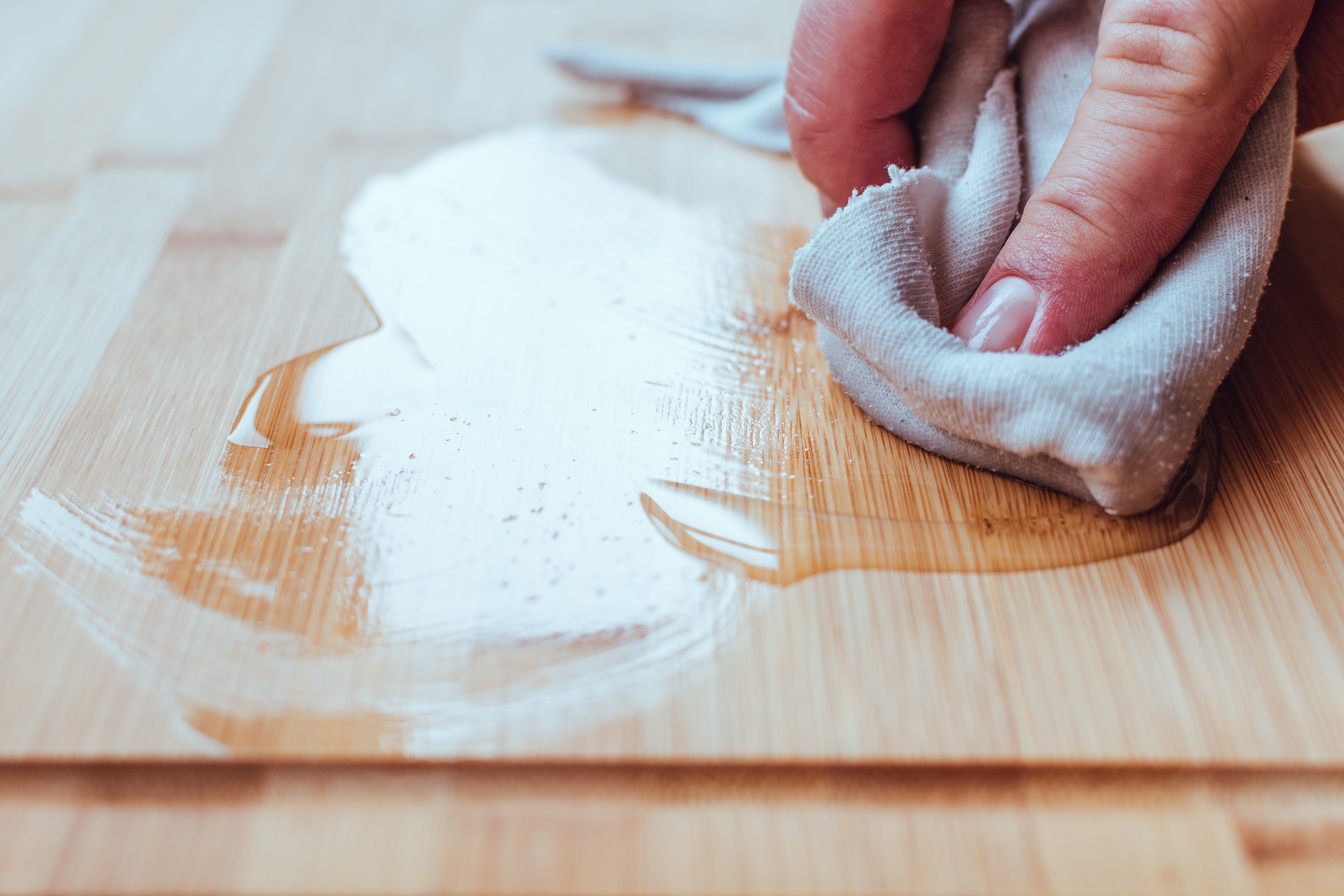 Applying coconut oil to a wood cutting board Applying coconut oil to a wood cutting board