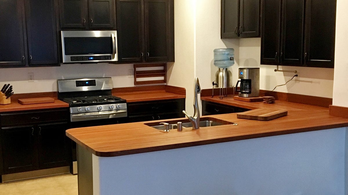 A newly remodeled kitchen counter made of cherry wood.